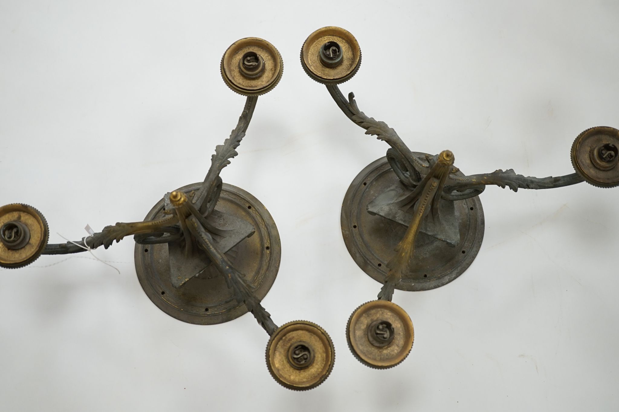 A pair of 3-light ormolu ceiling lights., 36 cms high.